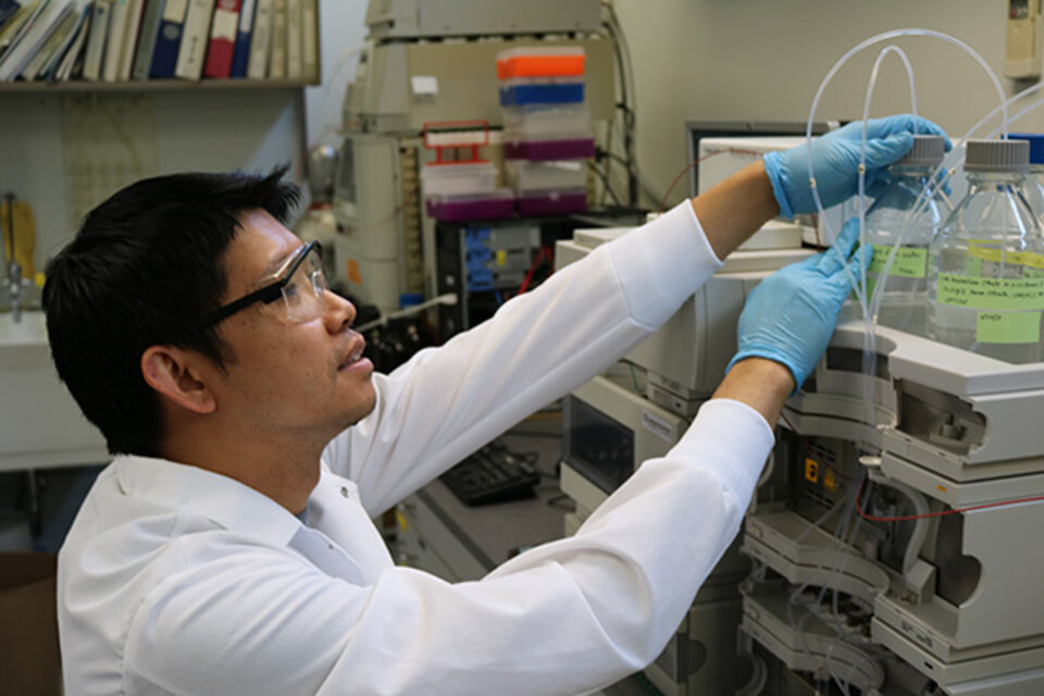 Laboratory technician works on equipment 